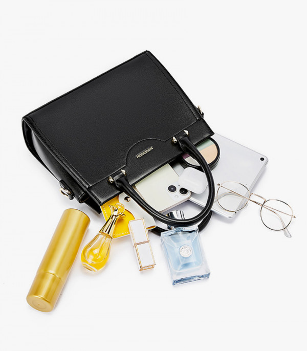 Capacity of the MOSSDOOM AMANDE black color tote bag, shown open with a phone, glasses, and beauty products.