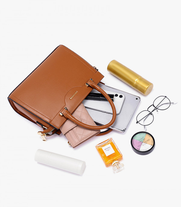 Capacity of the MOSSDOOM AMANDE Camel color tote bag, shown open with a wallet, phone, and beauty products.
