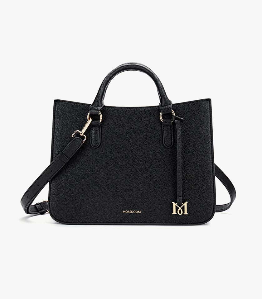 MOSSDOOM MIRABELLE structured handbag, black color, carried by hand by a model.
