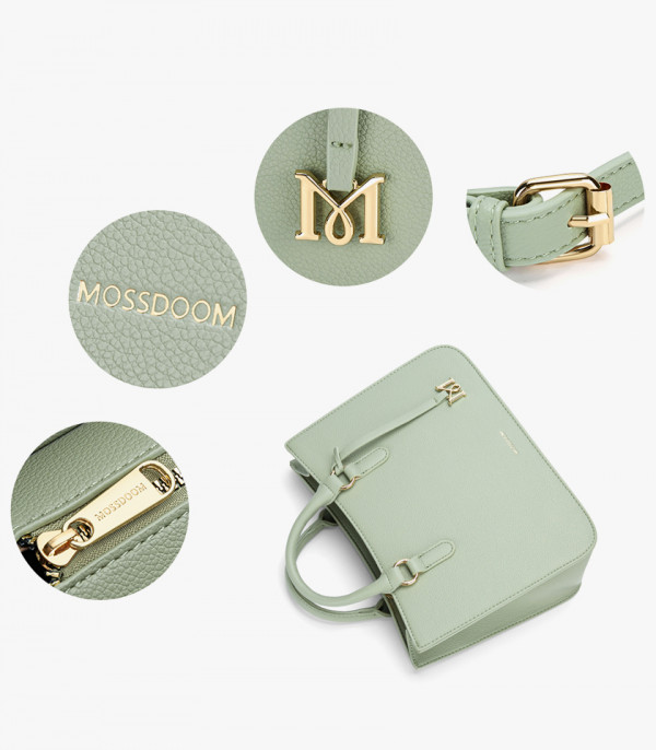 Close-up on the details of the MOSSDOOM MIRABELLE bag: logo, brand name, strap buckle, and zipper.