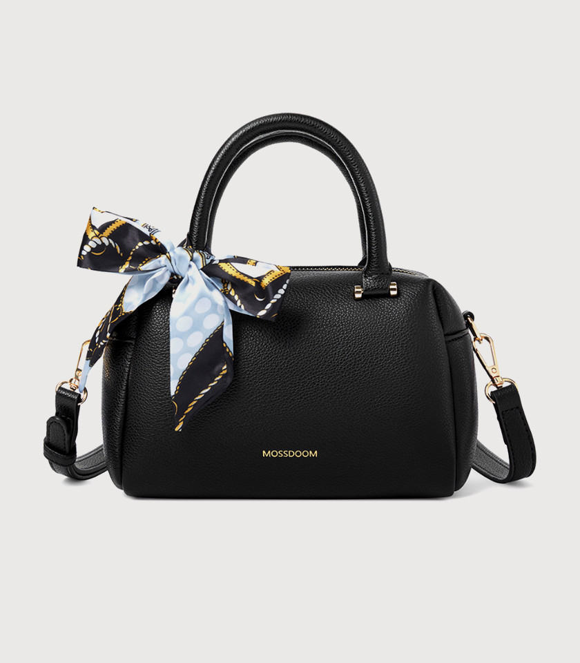 Model holding the MOSSDOOM MARCIA top handle bag, Black color.
