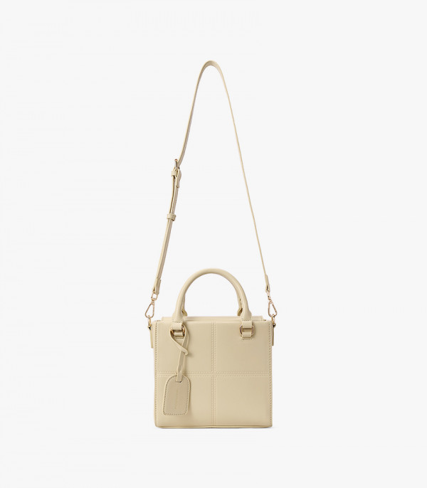 MOSSDOOM CUBIQUE structured handbag, Apricot color, with its shoulder strap visible.