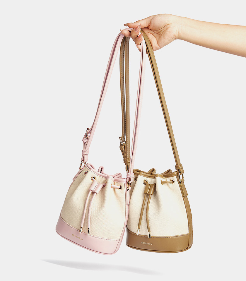 Top view of the brown Alicia bucket bag, showing the drawstring opening and the strap.