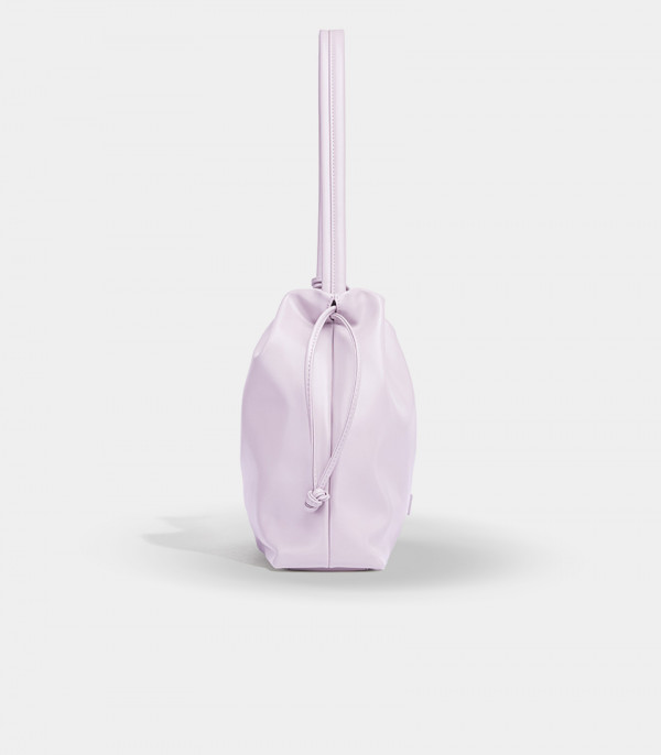 Side view of the lilac Danica bag showing the drawstring closure.