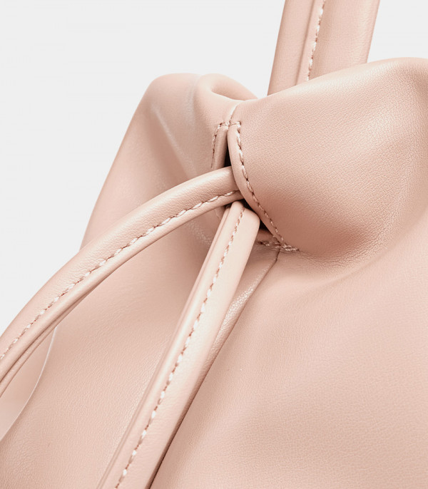Close-up on the drawstring knot of the pink MOSSDOOM Danica bag.
