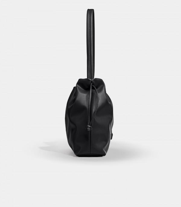 Side view of the black Danica bag showing the drawstring closure.