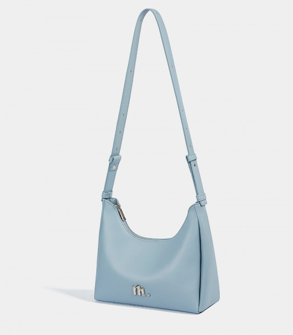 MOSSDOOM Deanna sky blue crossbody bag hanging by its strap.