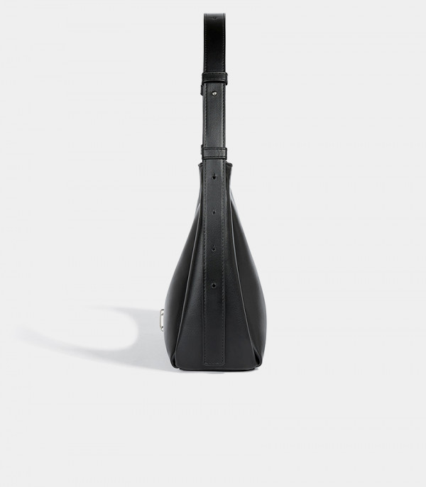 Profile of the Deanna black handbag showing the adjustable strap details.