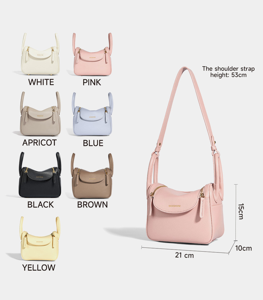 MOSSDOOM Zenith ivory crossbody bag with a decorative scarf on the handle.
