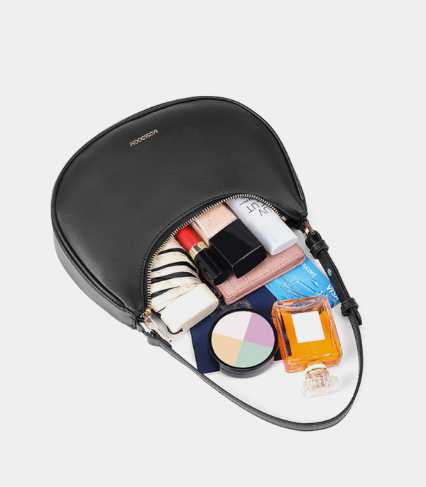 Inside of the MOSSDOOM Kattie black hobo bag with several items to show its capacity.