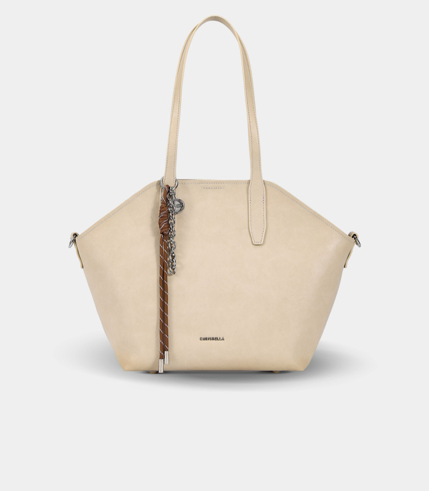 TRAPEZIO tote bag – CHRISBELLA Cream color, front view with charm.
