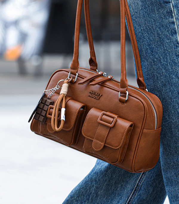 DISNEY MICKEY MOUSE bowling shoulder bag, Camel color, lifestyle view worn by a model.